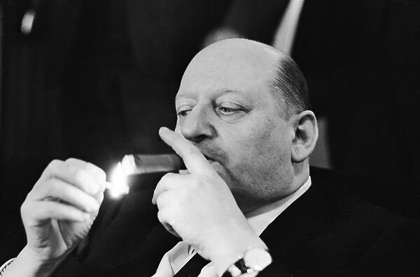 Media Mogul Lord Lew Grade lighting his cigar with a match. 24th January 1967