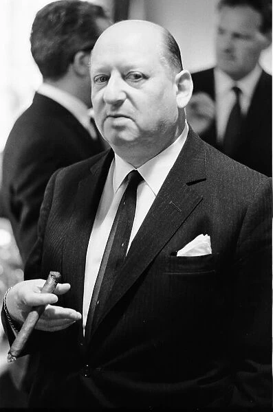Media Mogul Lord Lew Grade poses for the camera holding a cigar. 24th January 1967