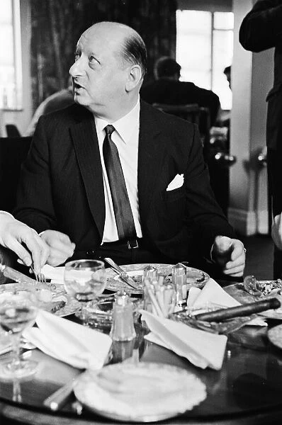 Media Mogul Lord Lew Grade seated at the table at a dinner party. 24th January 1967