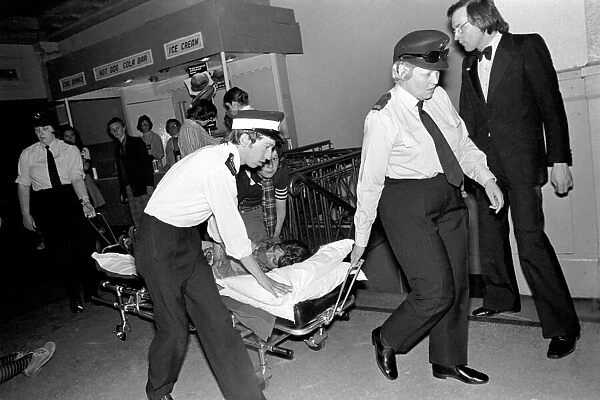 Medical officers attend to injured fans of the Bay City Rollers at their gig in Cardiff