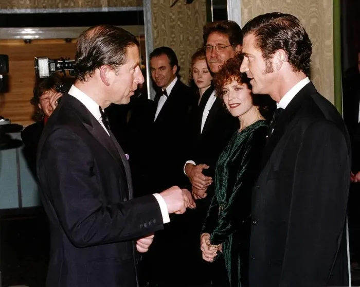 Framed Print : Mel Gibson actor speaking to Prince Charles at the premiere of his film Framed Print : Mel Gibson actor speaking to Prince Charles at the premiere of his film