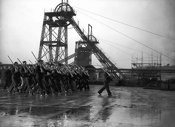 Member of the Home Guard marching at a coal mine during WW2