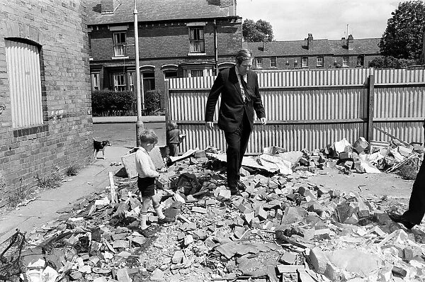 Member of Parliament for Birmingham Sparkbrook Roy Hattersley visits slum housing in
