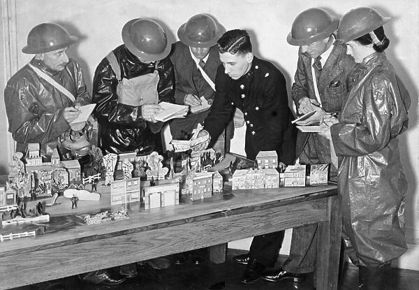 Members of the Air Raid Precautions Services receiving instruction before they go out