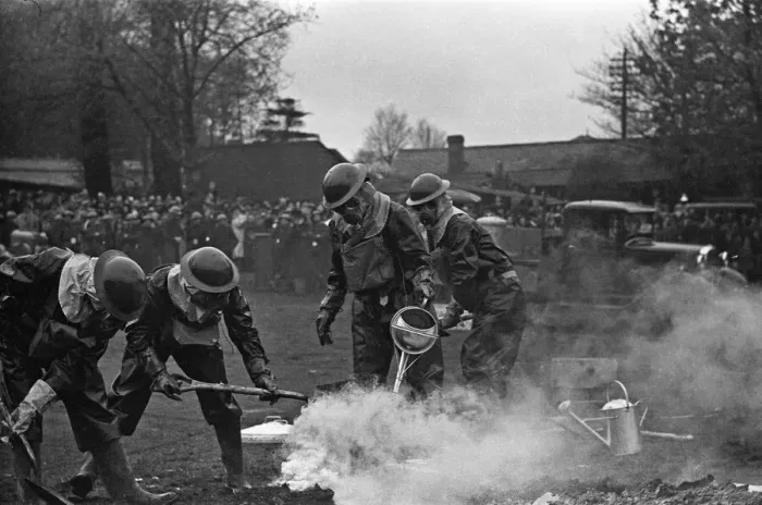 Framed Print : Members of the ARP demonstrate how to deal with a suspected gas attack during a series of