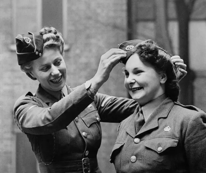 Framed Print : Members of the ATS adjust their caps before a parade. March 1944 P010241 Framed Print : Members of the ATS adjust their caps before a parade. March 1944 P010241