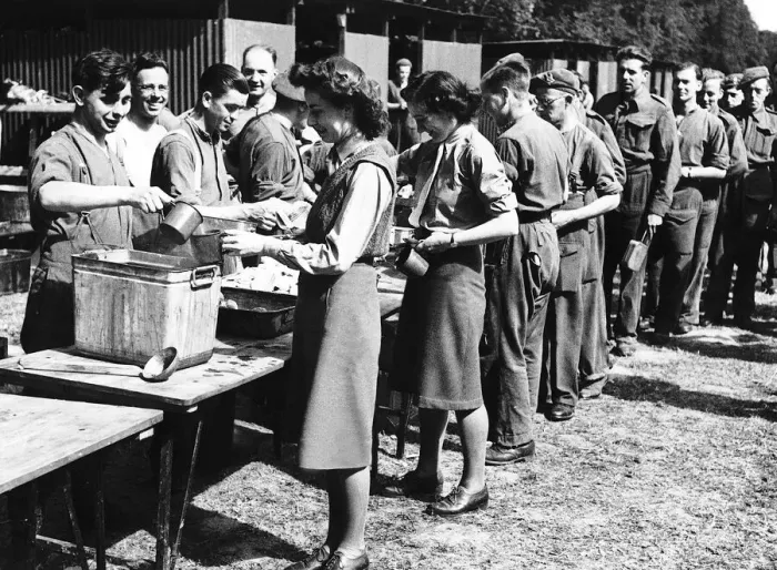 Framed Print : Members of the ATS line up with soldiers to get their first meal in France during WW2 Framed Print : Members of the ATS line up with soldiers to get their first meal in France during WW2