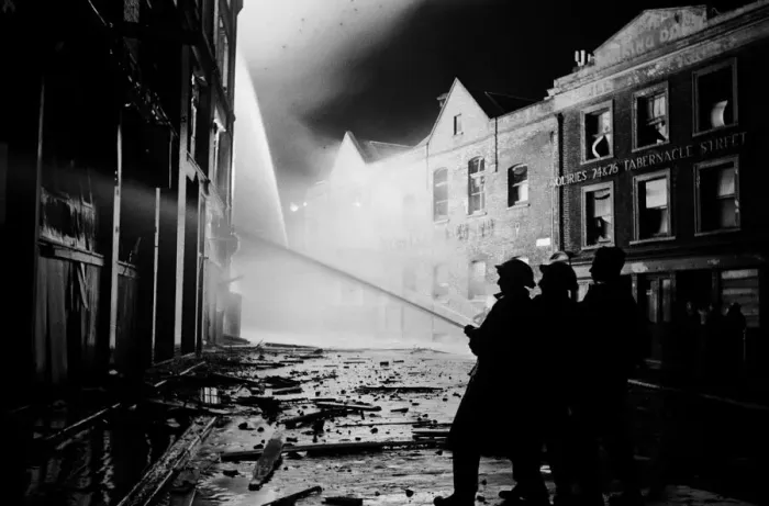 Framed Print : Members of the Auxiliary Fire Service and London Fire Brigade seen here fighting a fire