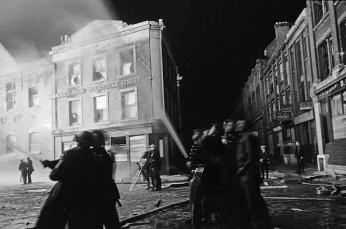 Framed Print : Members of the Auxiliary Fire Service and London Fire Brigade seen here fighting a fire