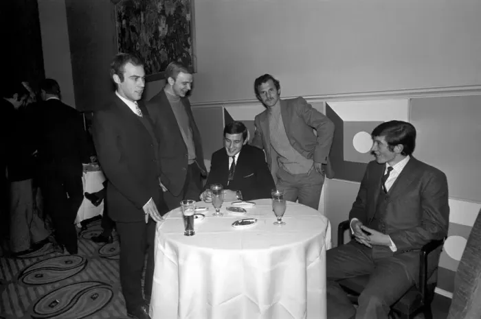 Framed Print : Five members of the Belgians K Lierse football team having a talk over prospects around
