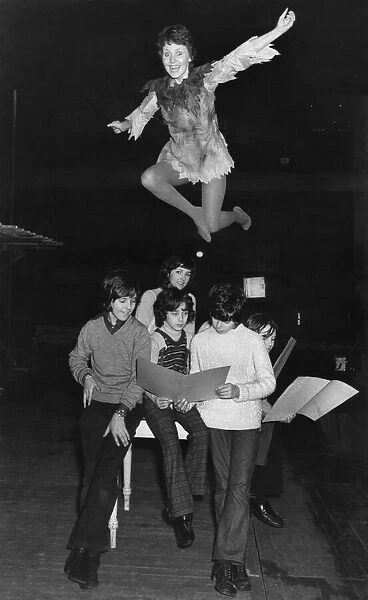 Members of the cast study their lines as Lulu flies high. December 1972 P035536