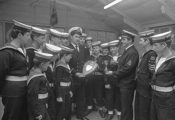 Members of Coventry Sea Cadet Corp band admiring the three trophies they won at