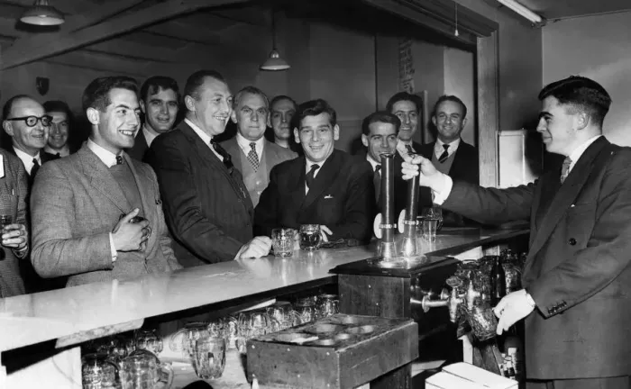 Framed Print : Members of Davenport Rugby league football club seen here enjoying a pint of beer after a