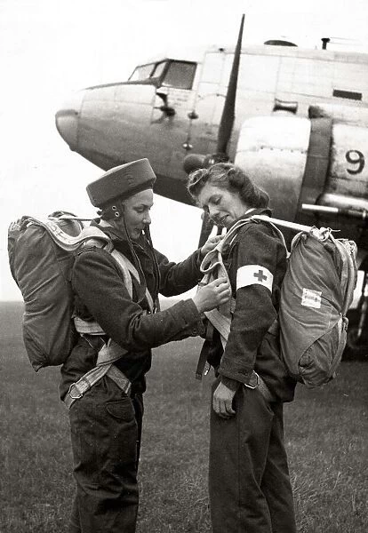 Two members of the Flying Sisters, a new airborne British nursing unit prepare their