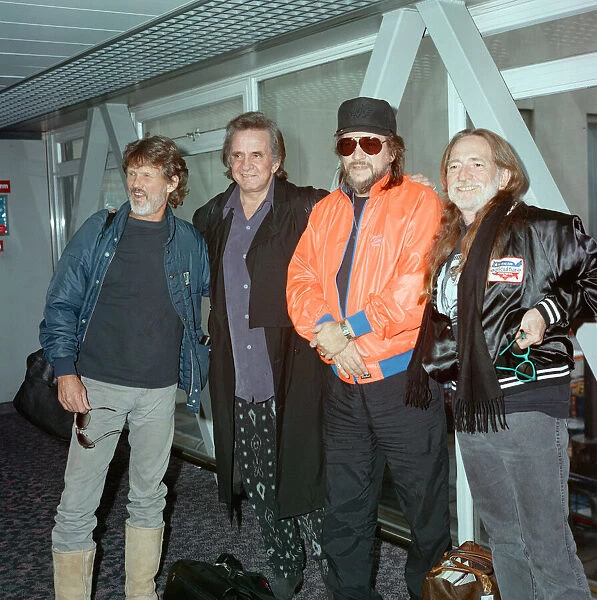 Members of The Highwaymen at Heathrow Airport. Kris Kristofferson, Johnny Cash