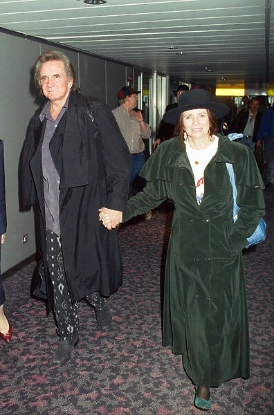 Members of The Highwaymen at Heathrow Airport. Johnny Cash and June Carter Cash