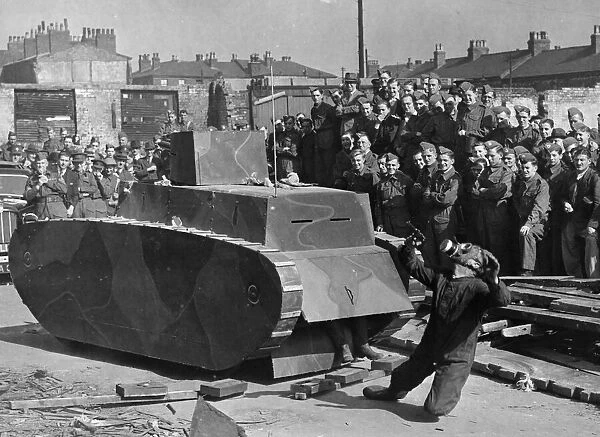 Members of the Home Guard in Liverpool, watching a demonstration by the army in Anti Tank