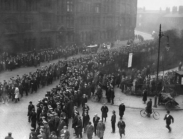 Members of the National Unemployed Workers Movement march through Ardwick Green