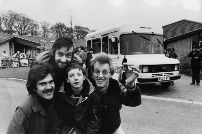 Framed Print : Three members of pop group Lindisfarne visit Trouts Lane Special School, in Durham City