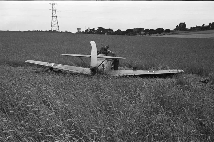 Framed Print : Members of the RAF technical team examine a downed Messerschmitt BF109 during the Battle Framed Print : Members of the RAF technical team examine a downed Messerschmitt BF109 during the Battle