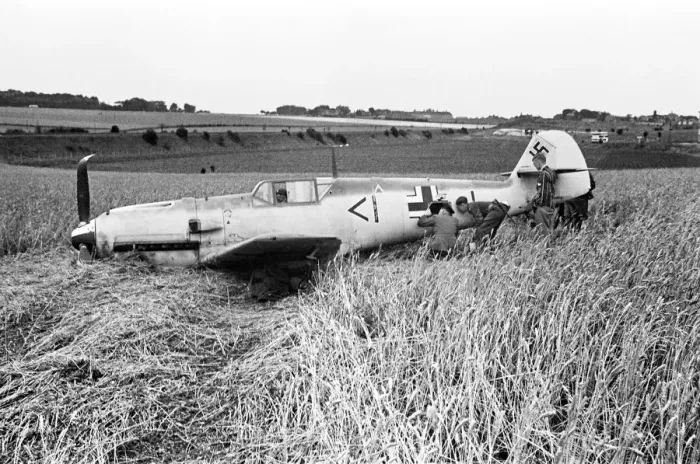 Framed Print : Members of the RAF technical team examine a downed Messerschmitt BF109 during the Battle Framed Print : Members of the RAF technical team examine a downed Messerschmitt BF109 during the Battle