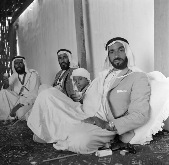 Framed Print : Members of the ruling Al Nayhan family seen here enjoying tea in the place just outside Framed Print : Members of the ruling Al Nayhan family seen here enjoying tea in the place just outside