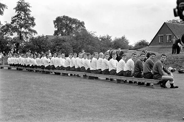 Members of the Tottenham Hotspur team line up for a group photograph before training