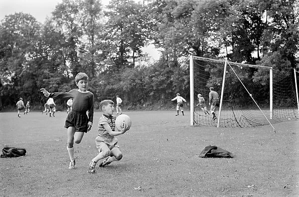 Members of the Tottenham Hotspur team training. Children of the Spurs players make