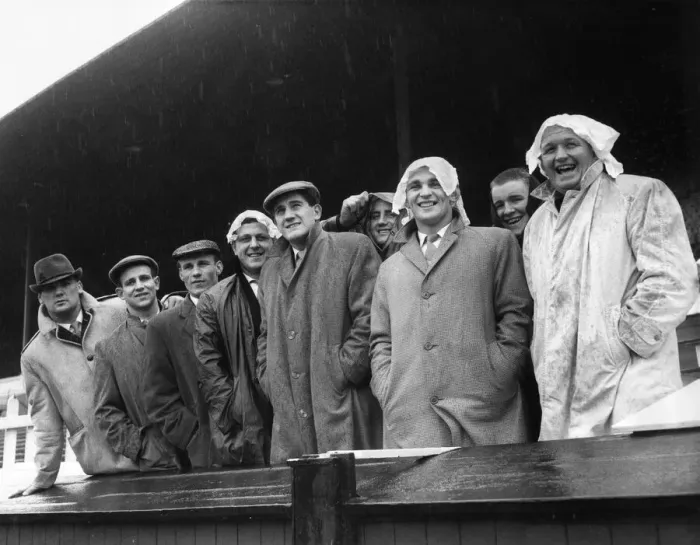 Framed Print : Members of the Wakefield rugby league team look pleased as they watch the rain lash down Framed Print : Members of the Wakefield rugby league team look pleased as they watch the rain lash down