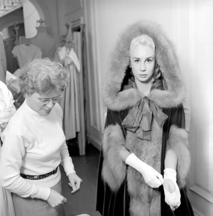 Framed Print : Members of the Wardrobe and make-up departments at Pinewood Studios help the actresses Framed Print : Members of the Wardrobe and make-up departments at Pinewood Studios help the actresses