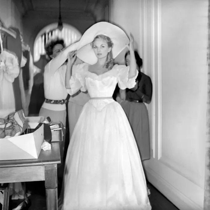 Framed Print : Members of the Wardrobe and make-up departments at Pinewood Studios help the actresses Framed Print : Members of the Wardrobe and make-up departments at Pinewood Studios help the actresses