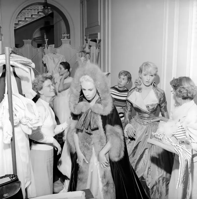 Framed Print : Members of the Wardrobe and make-up departments at Pinewood Studios help the actresses Framed Print : Members of the Wardrobe and make-up departments at Pinewood Studios help the actresses