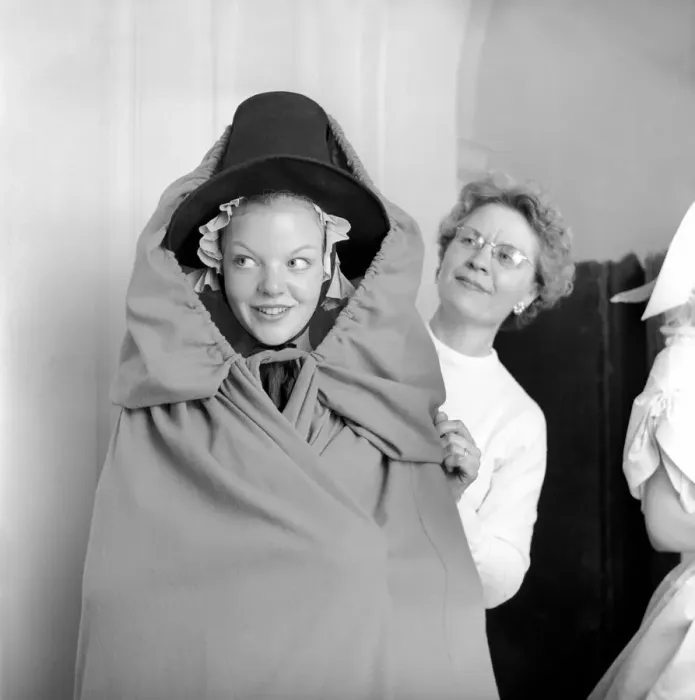 Framed Print : Members of the Wardrobe and make-up departments at Pinewood Studios help the actresses Framed Print : Members of the Wardrobe and make-up departments at Pinewood Studios help the actresses