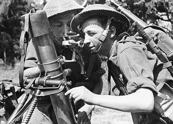 Two members of the Young Soldiers unit in the British Army train on the range finder of a