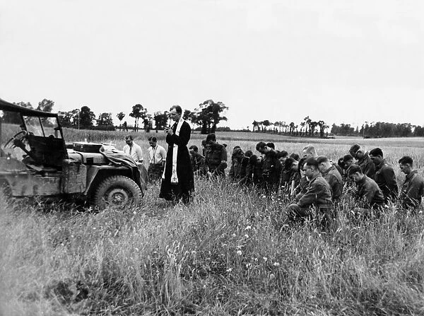 Men of the 11th armoured Division at a communion service in a field prior to the attack