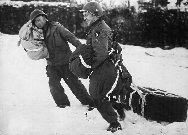 Two men of the American 101st Airborne Division, besieged in the Belgian town of Bastogne