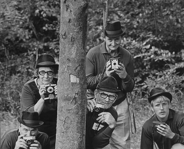 Men with cameras wearing robin hood costumes