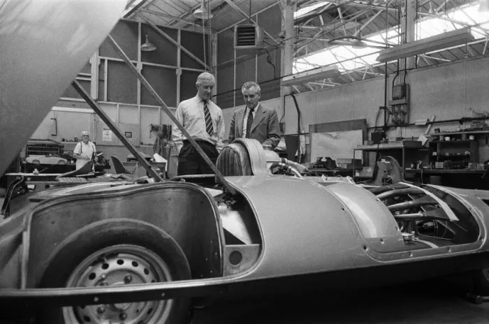 Framed Print : Men, including Syd Enever and Tommy Wisdom looking at the MG EX181 which is being worked Framed Print : Men, including Syd Enever and Tommy Wisdom looking at the MG EX181 which is being worked