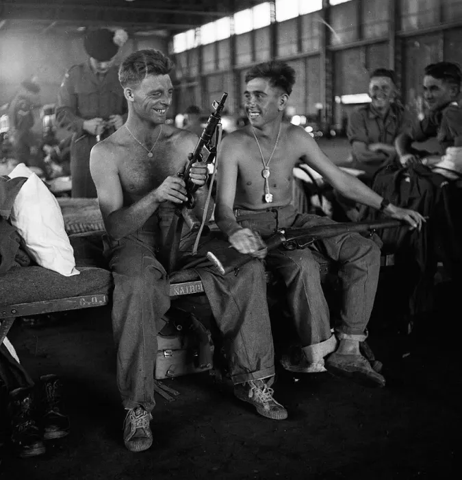 Framed Print : Men of the Lancashire Fusiliers camped in a hanger in Nairobi clean their weapons Framed Print : Men of the Lancashire Fusiliers camped in a hanger in Nairobi clean their weapons