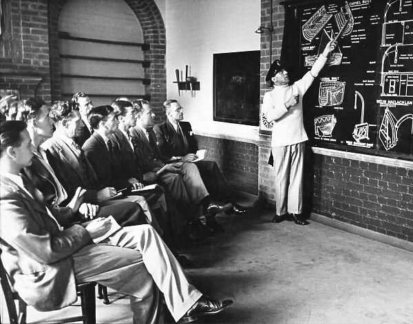 Men learning all about ship stoke holes from the blackboard