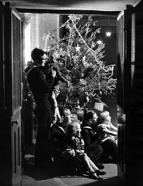 Men on leave from H. M. S. Anson give a Christmas party for the pupils of the Cranbrook