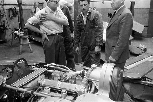 Men looking at the engine of the MG EX181. 21st July 1959