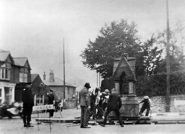 Men moving street furniture. Riverhead, junction of Maidstone Road. Kent. Circa 1930