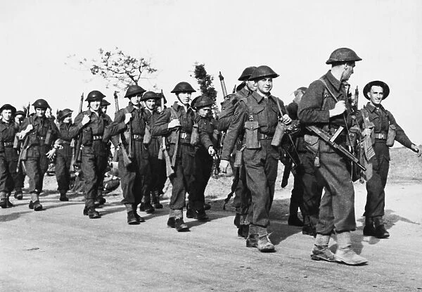 Men of the R. A. F. regiment marching inland to take possession of Maison Blanche aerodrome