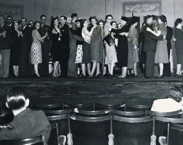 Framed Print : Men and women try to forget the war for a few hours seen here dancing on the stage of Framed Print : Men and women try to forget the war for a few hours seen here dancing on the stage of