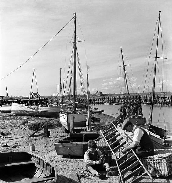 Two men at work at Rye Harbour, Sussex. November 1952 C5848