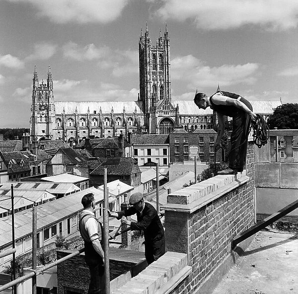 Men working in front of Canterbury Cathedral, Kent. Circa 1950s