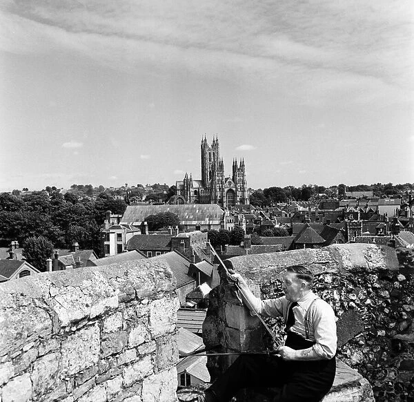 Men working in front of Canterbury Cathedral, Kent. Circa 1950s