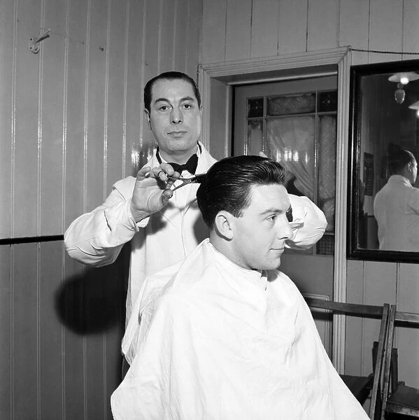 Mens Barbers Shop: Mr. Thomas the barber seen here having a joke with some of his