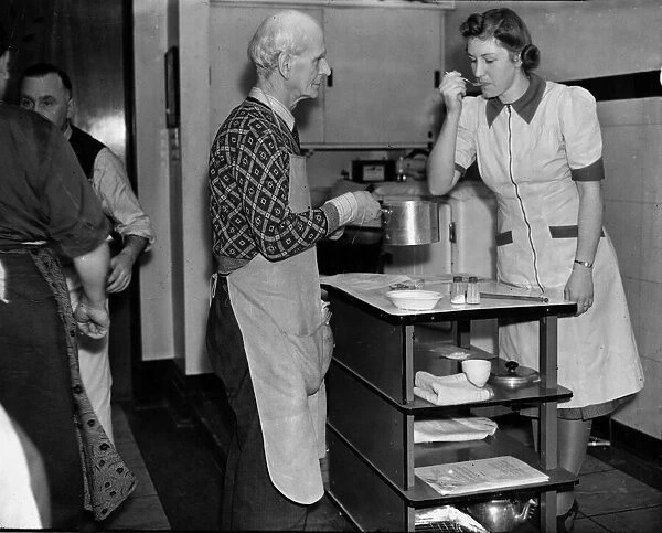 Mens cooking class, February 1944 An elderly man has his food tasted by one